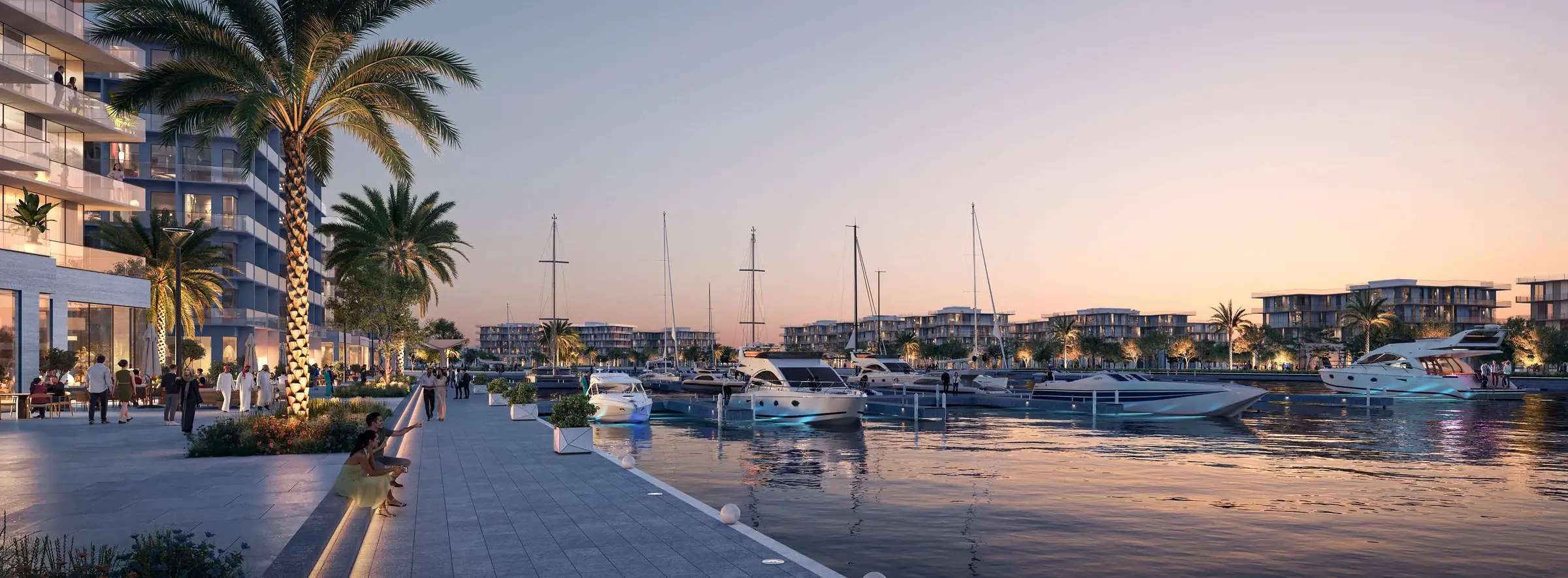 Superyachts moored along the Dubai Marina promenade at dusk, waterfront towers behind