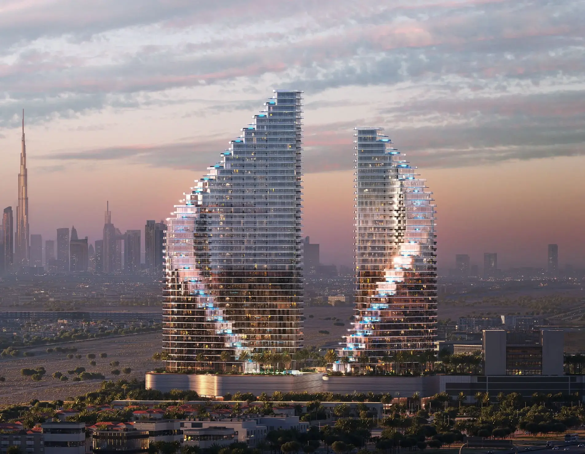 Newly launched residential towers rising against the Dubai skyline at dusk