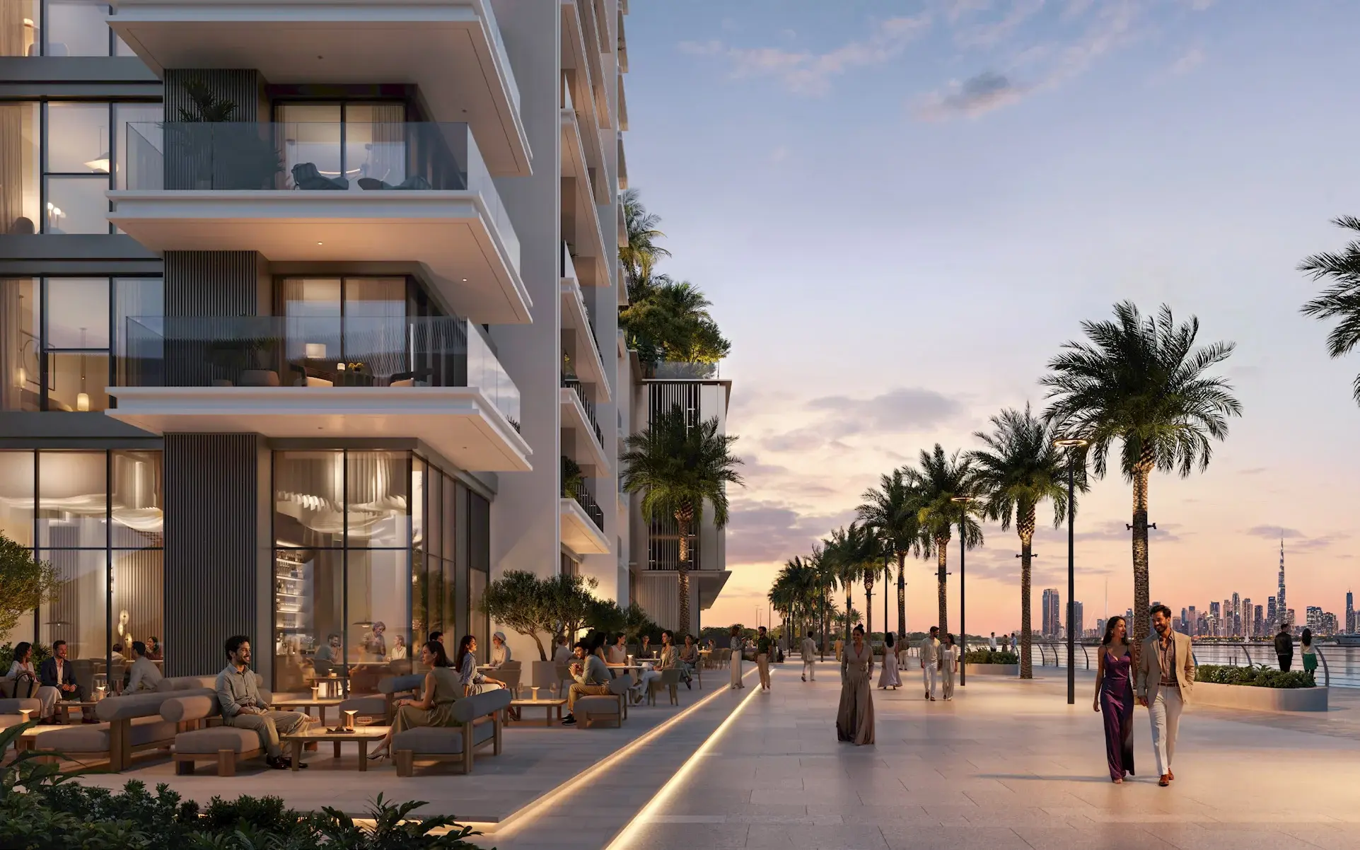 Palm-lined canal promenade at dusk with the Downtown Dubai skyline in the distance