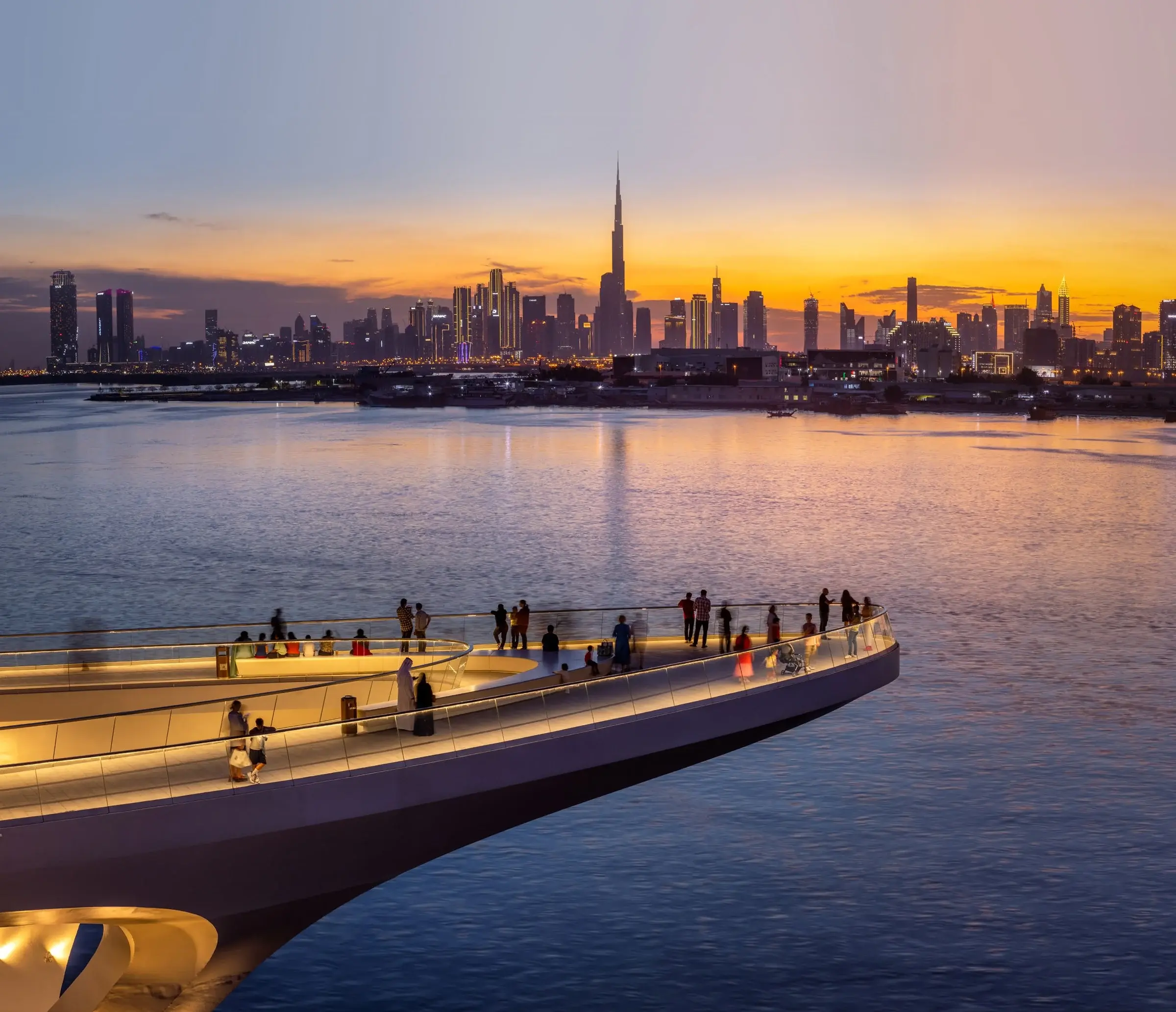 Elevated view of the Dubai skyline and waterfront spanning multiple districts